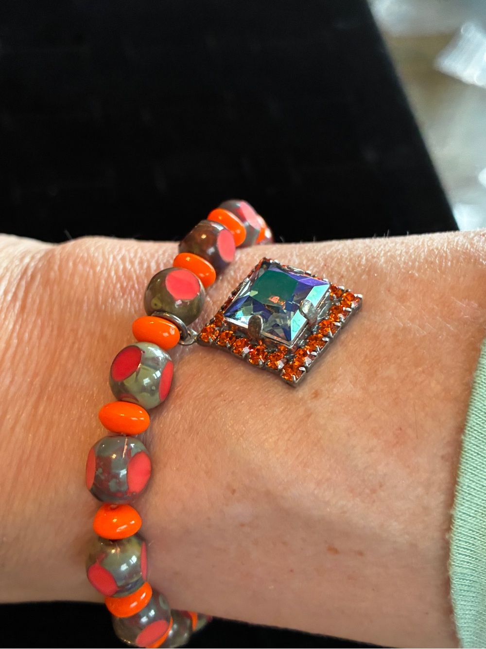 Sabika Beaded Bracelet with Orange Accents and Iridescent Square Charm